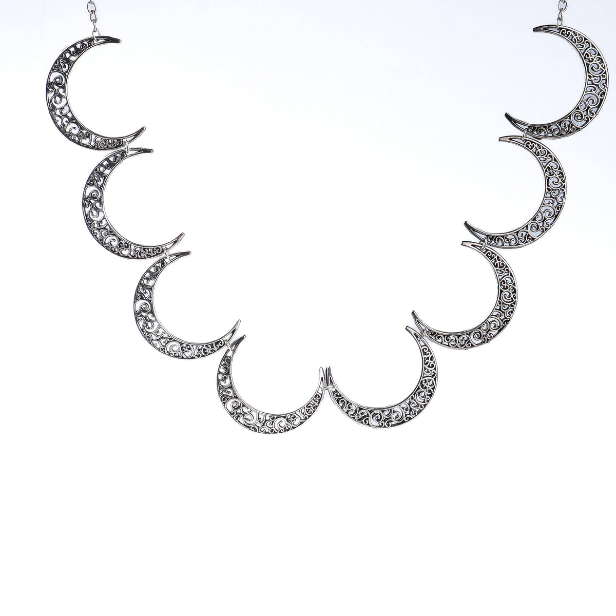 Flat-lay of a 22K gold-plated fashion necklace with complementary gold-plated jewelry and elegant accessories