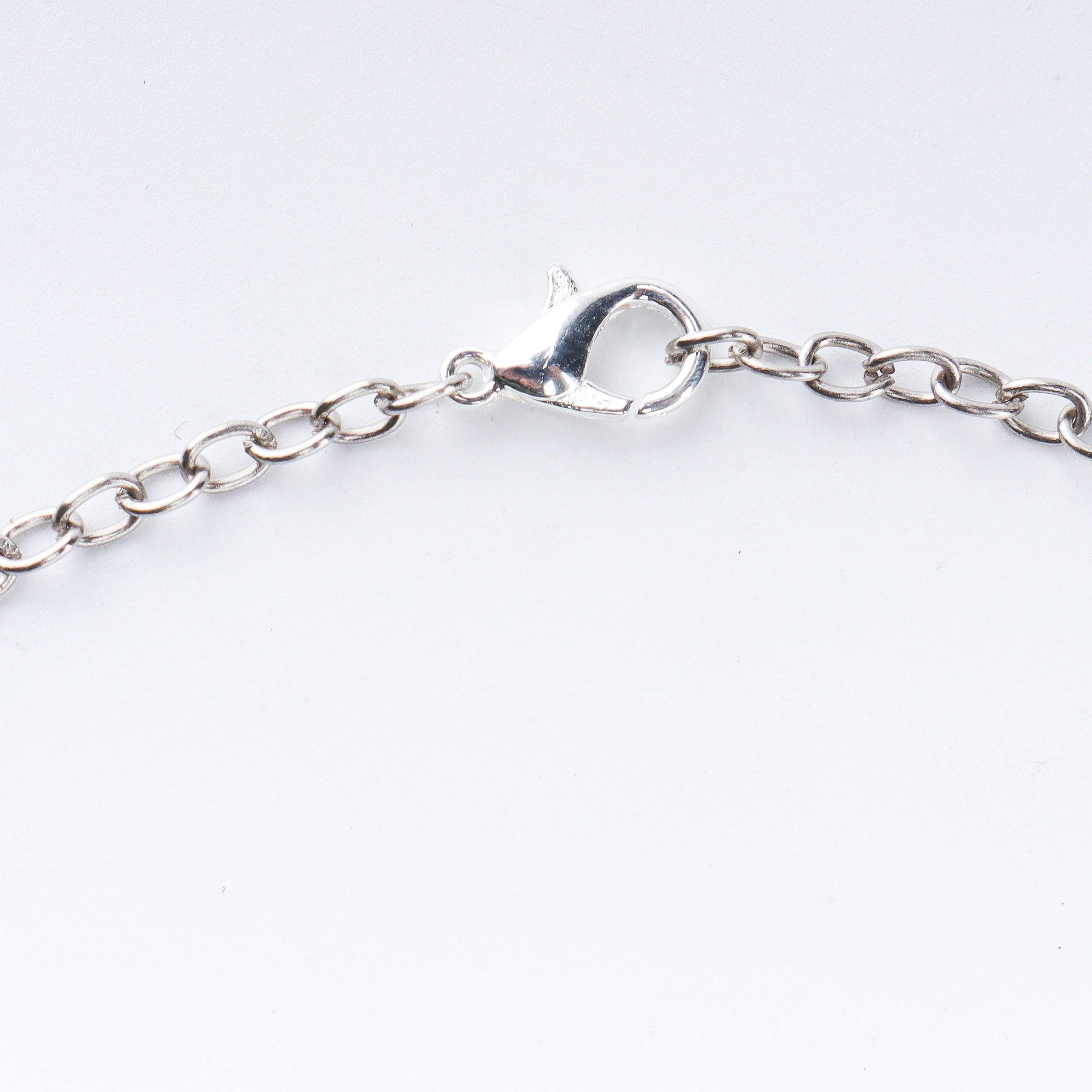 Angled view of a 22K gold-plated fashion necklace highlighting its elegant structure, design, and polished gold finish