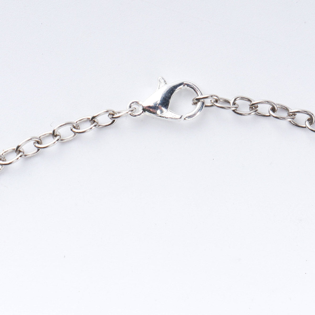 Angled view of a 22K gold-plated fashion necklace highlighting its elegant structure, design, and polished gold finish