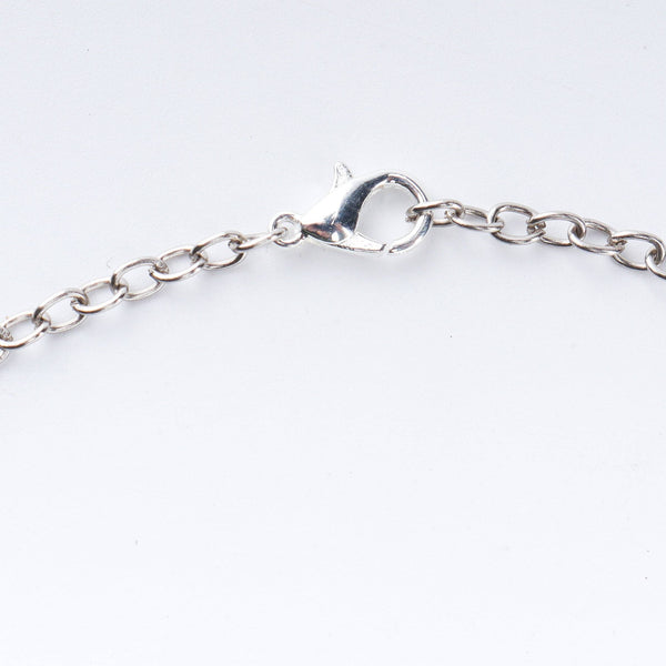 Angled view of a 22K gold-plated fashion necklace highlighting its elegant structure, design, and polished gold finish