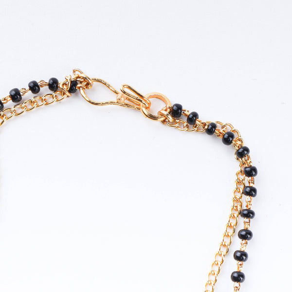 Angled view of 22K gold-plated fashion mangalsutra highlighting its elegant structure, unique design, and polished gold finish