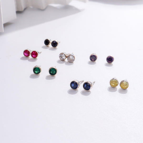 Colorful gemstone stud earrings in silver setting