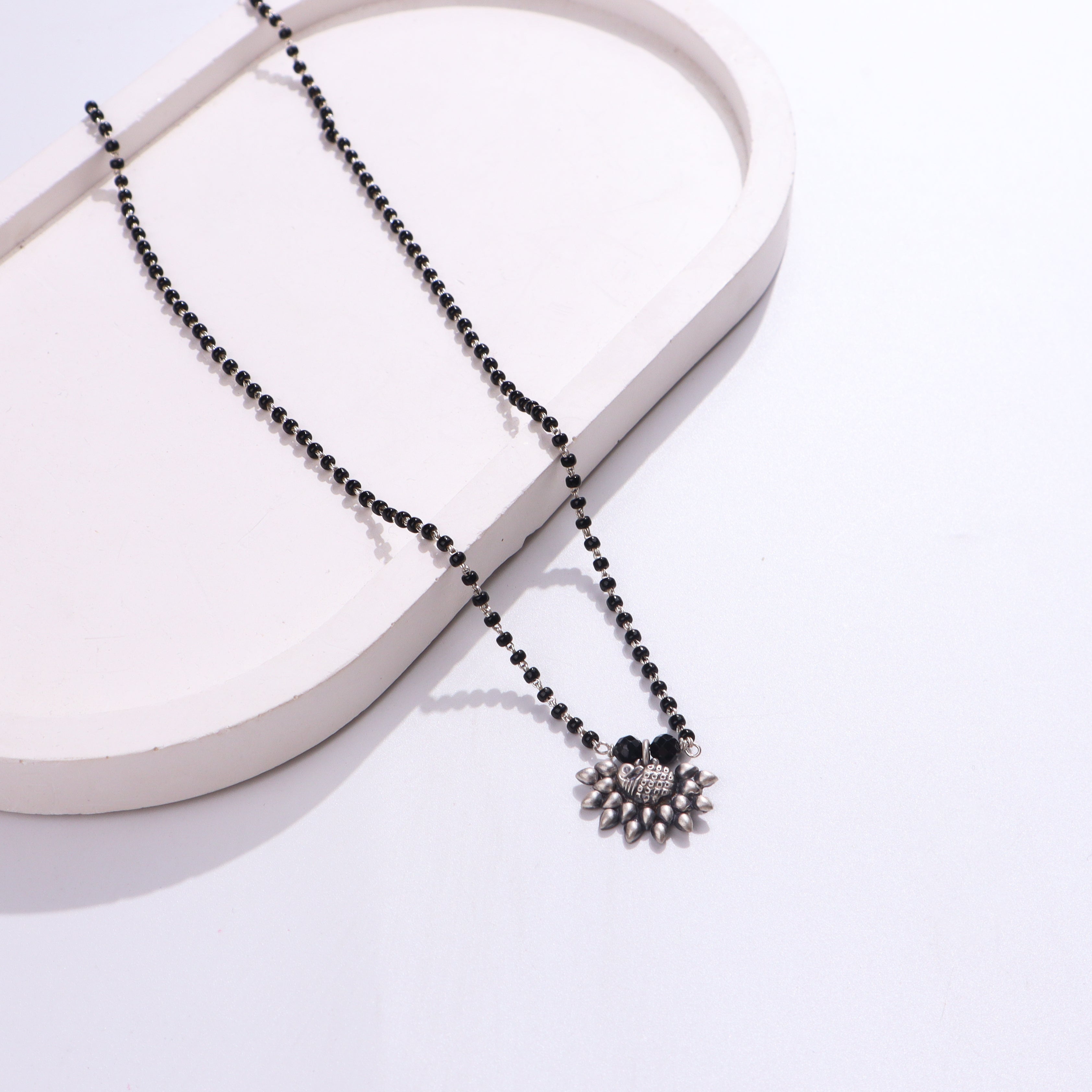 Black beaded silver mangalsutra with pendant