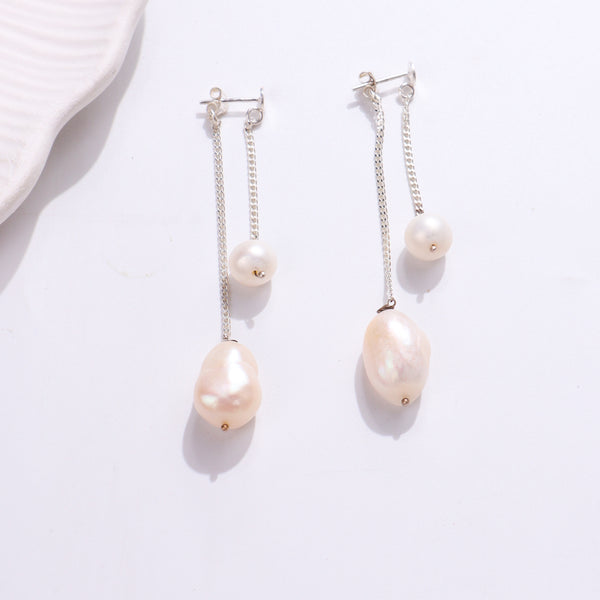 Elegant pearl drop earrings with silver chains