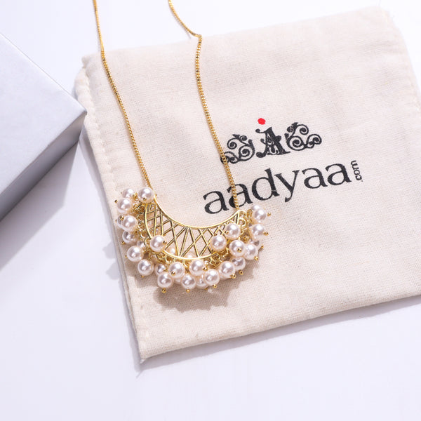 Gold pearl necklace with intricate design