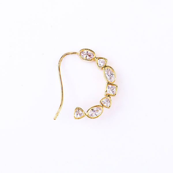 Flat-lay silver small nath stones left pierced on neutral background