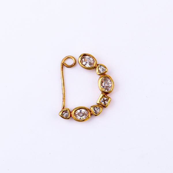 Flat-lay small CZ nath stones left clip on on neutral background