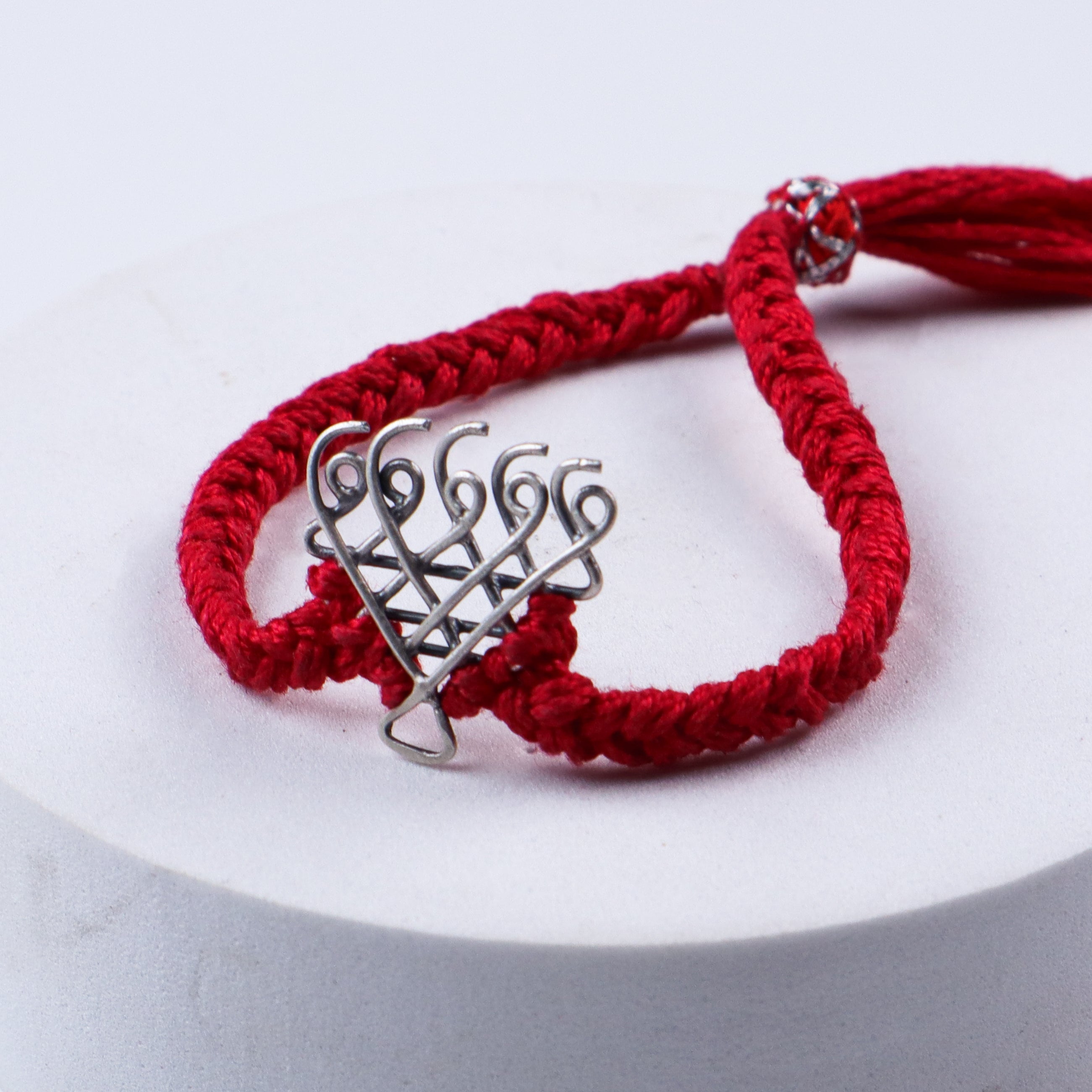 Red thread Saraswati silver bracelet design