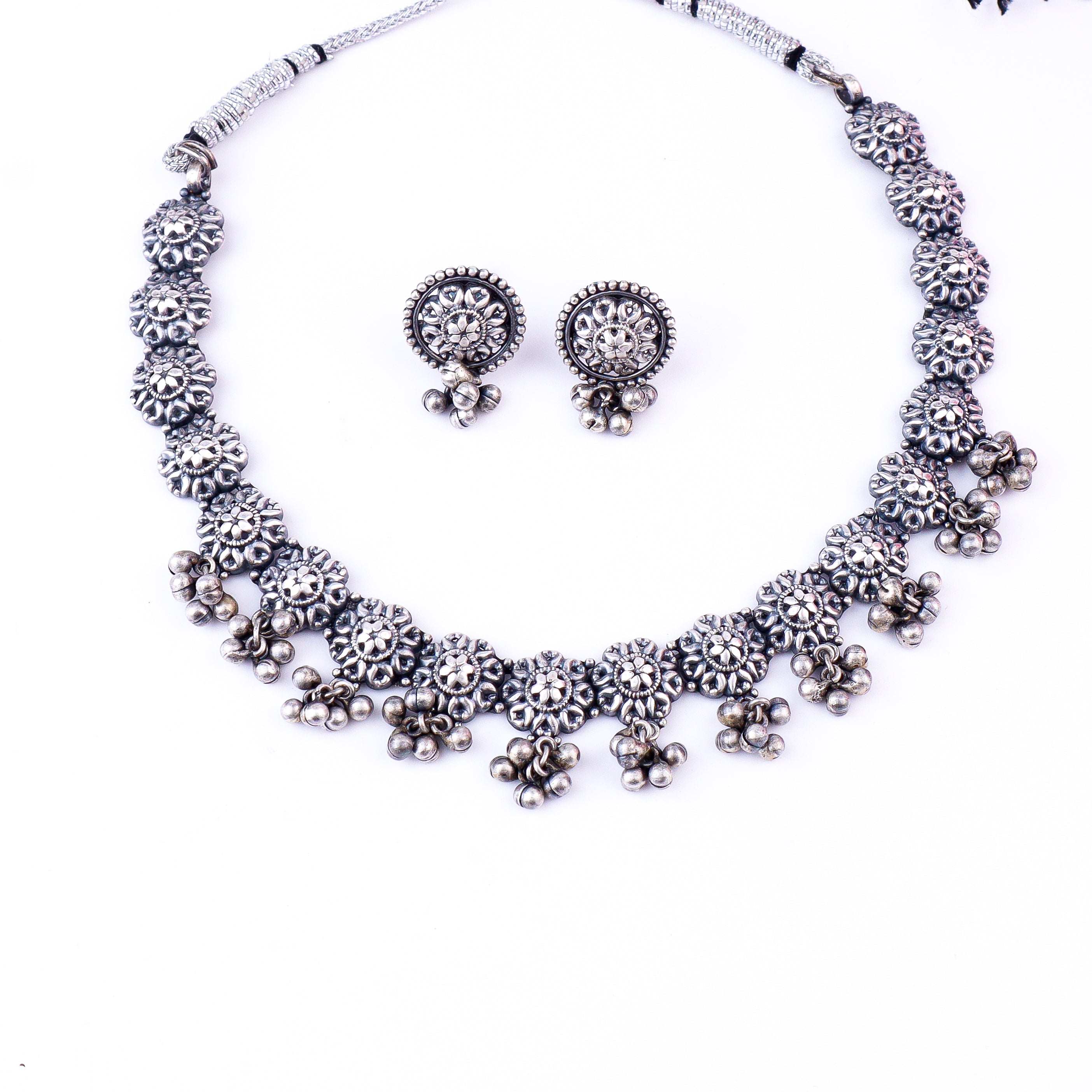 Silver floral jewelry set with necklace and earrings