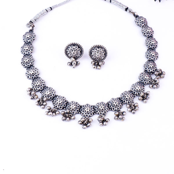 Silver floral jewelry set with necklace and earrings