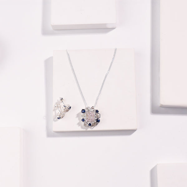 Silver Vivid Bloom pendant and earrings on white display