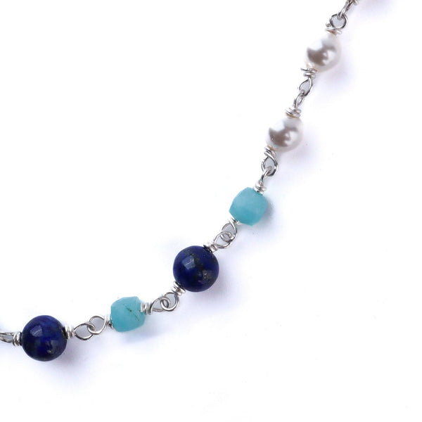 Macro detail of natural pearls and multicolor stones with 92.5 sterling silver finish