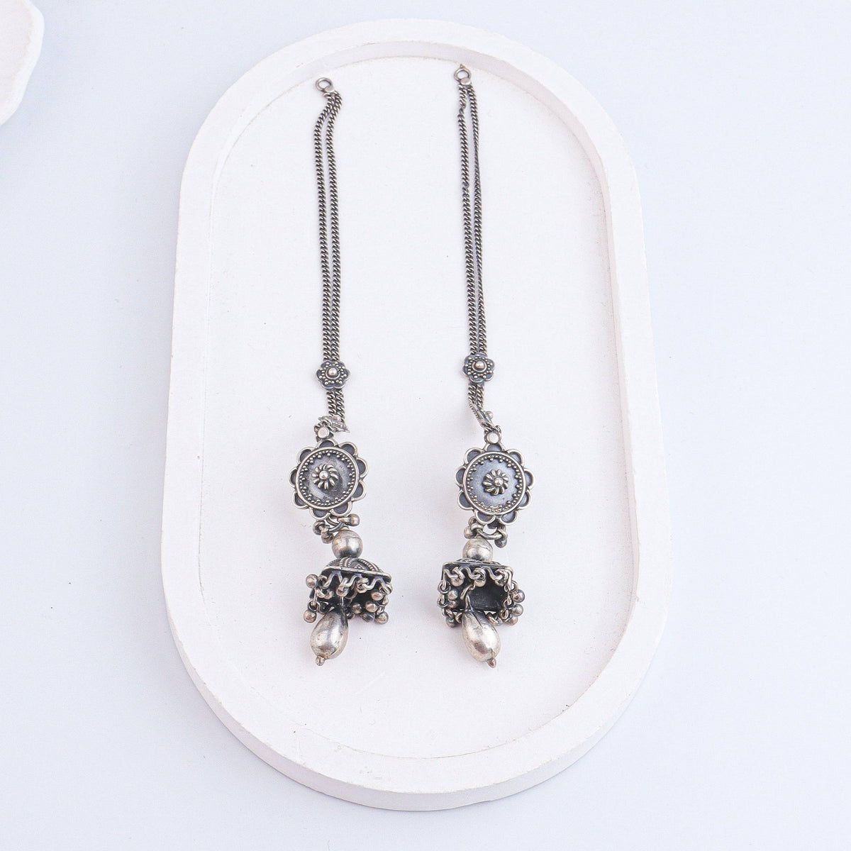 Angled view of Antique Silver Earrings in 92.5 sterling silver highlighting the detailed vintage design