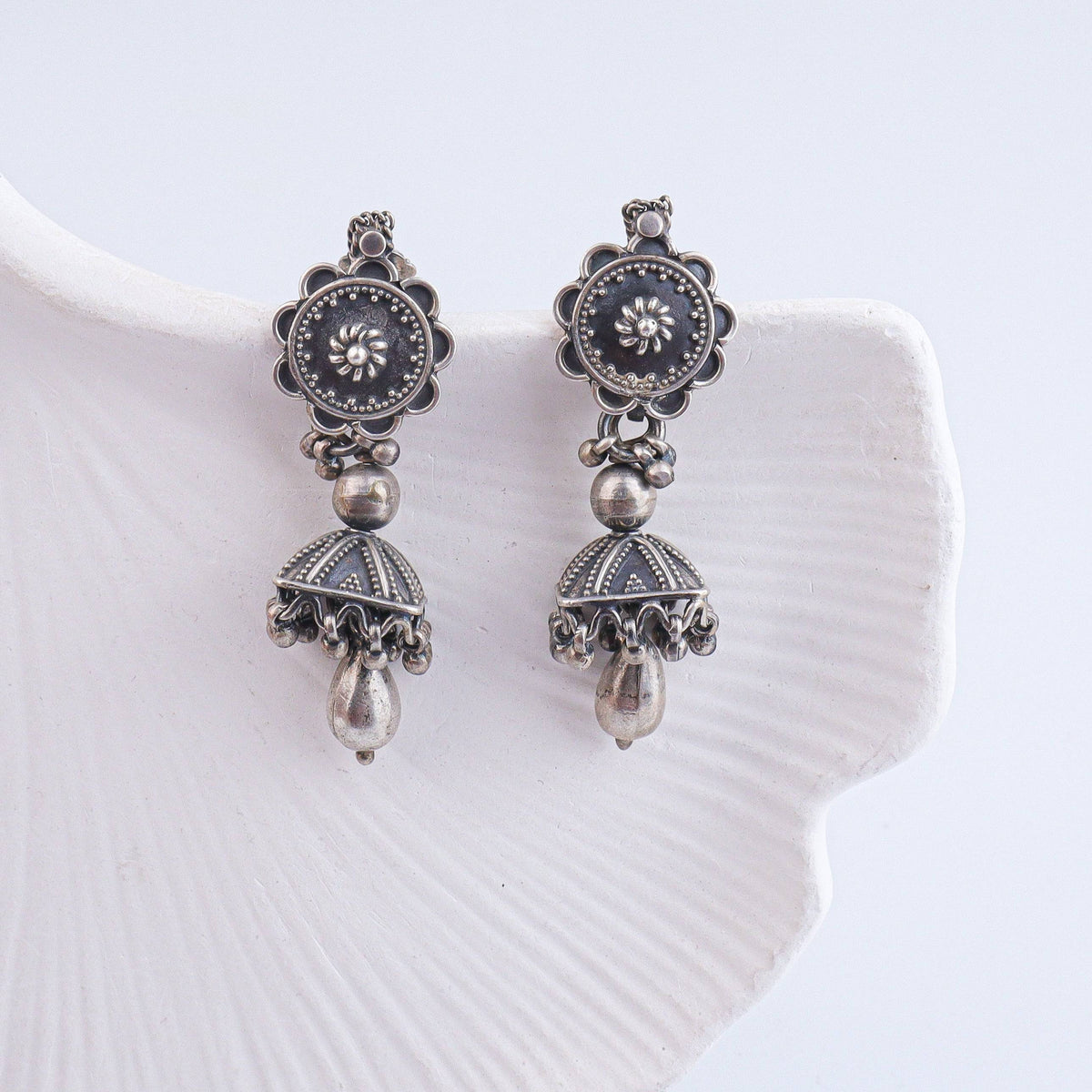 Close-up of Antique Silver Earrings showcasing intricate detailing, traditional craftsmanship, and antique silver finish