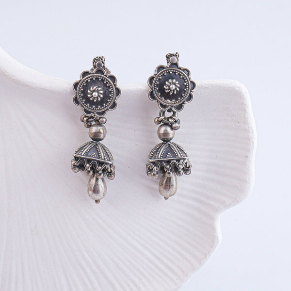 Close-up of Antique Silver Earrings showcasing intricate detailing, traditional craftsmanship, and antique silver finish