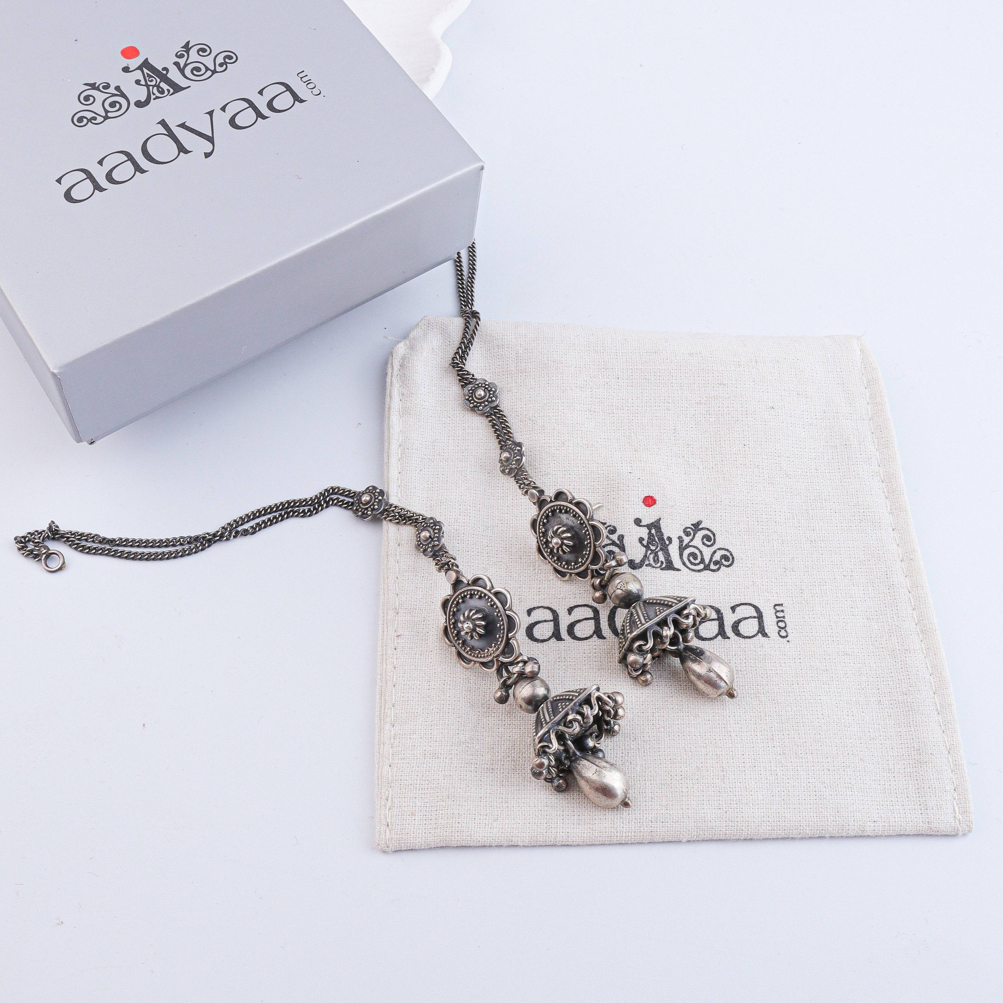 Detailed view of Antique Silver Earrings highlighting intricate motifs, textured surface, and antique silver finish
