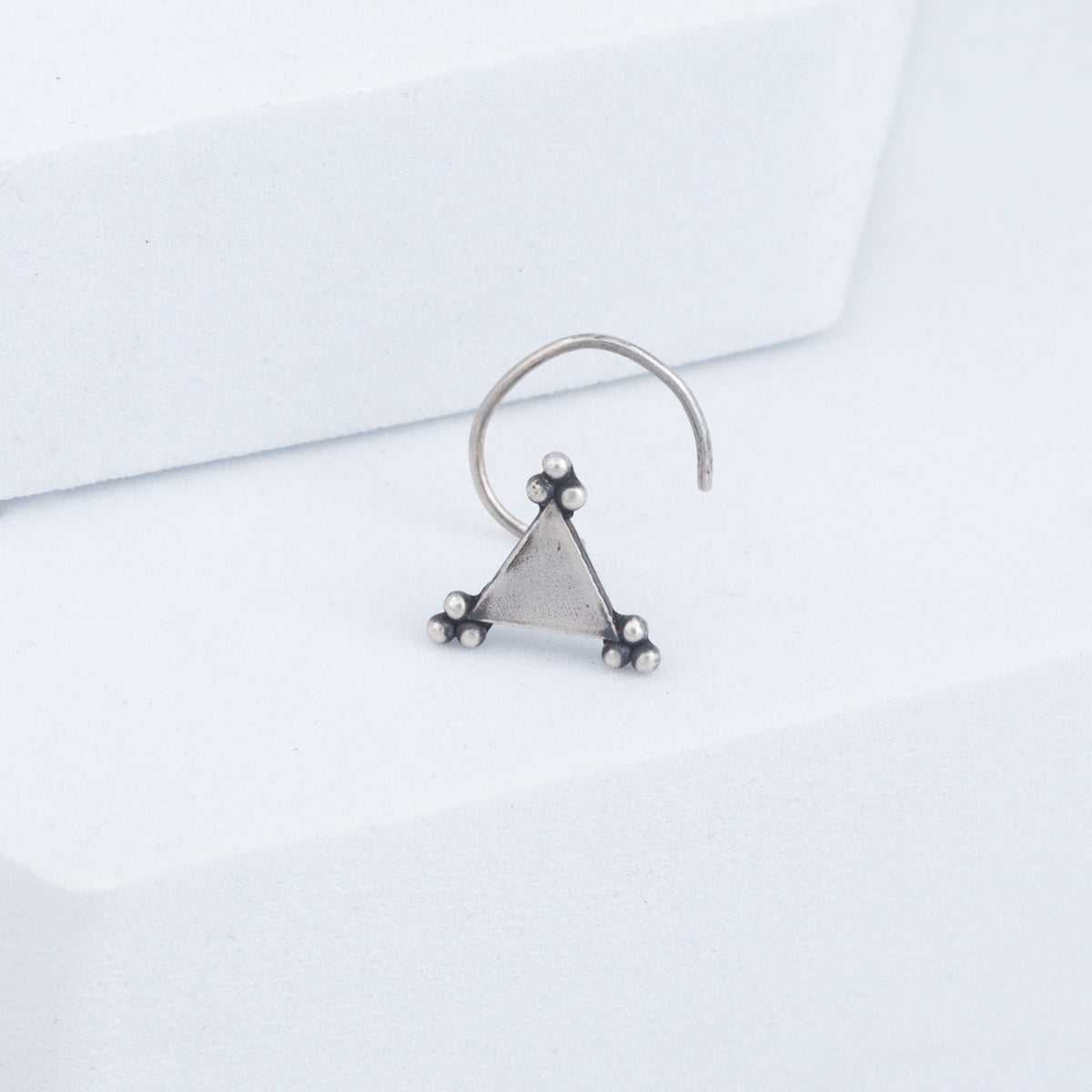 Handcrafted trikon silver nose pin polished finish