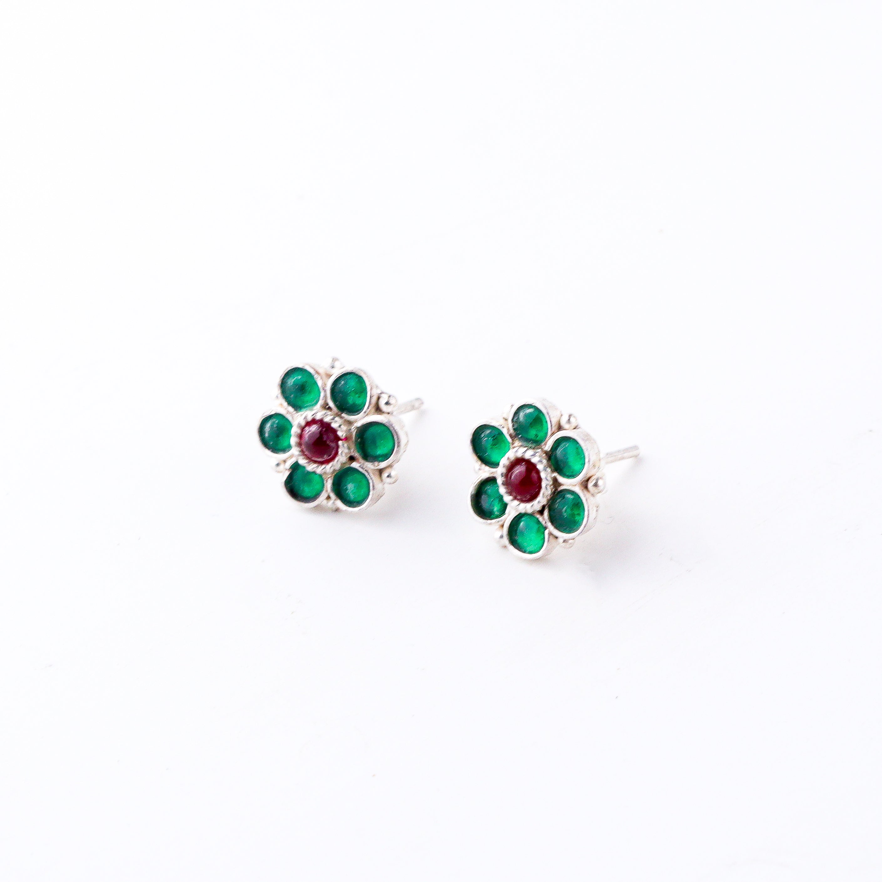 Green flower silver earrings close-up handcrafted detailing
