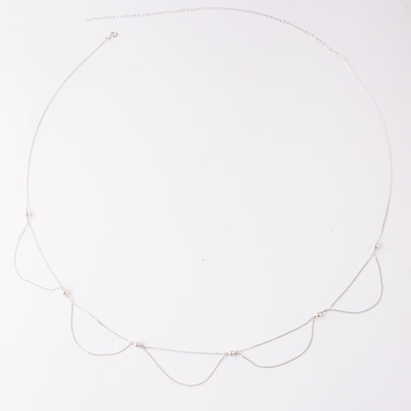 Elegant pearl and silver necklace on white background