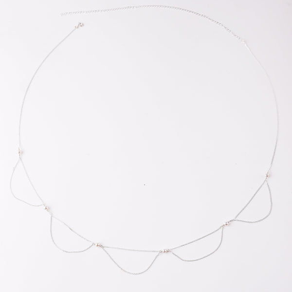 Elegant pearl and silver necklace on white background