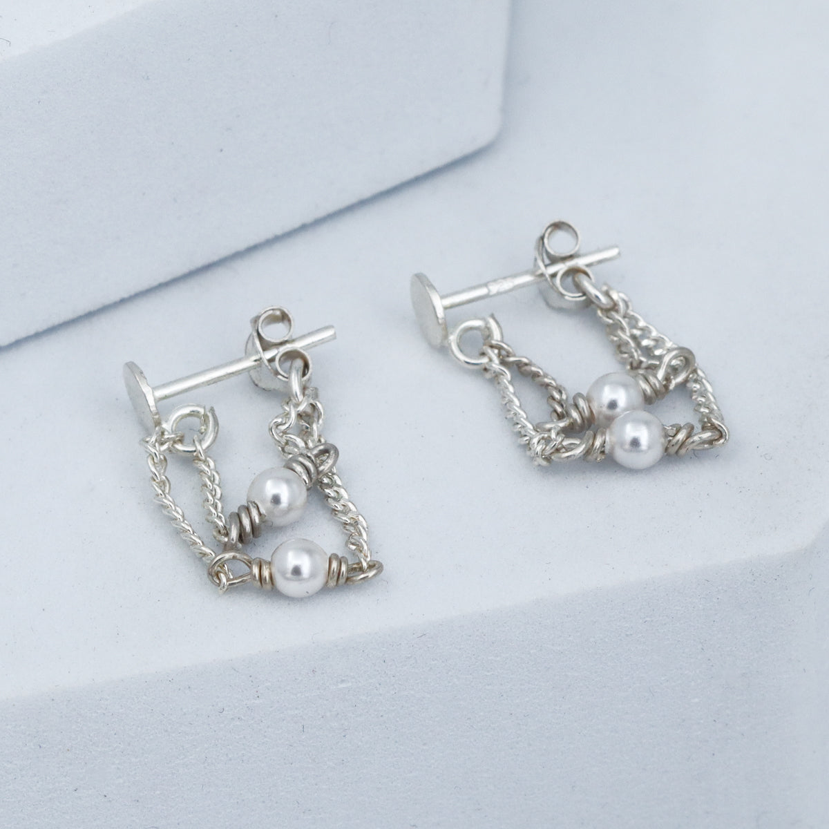 Minimal layered pearl earrings design