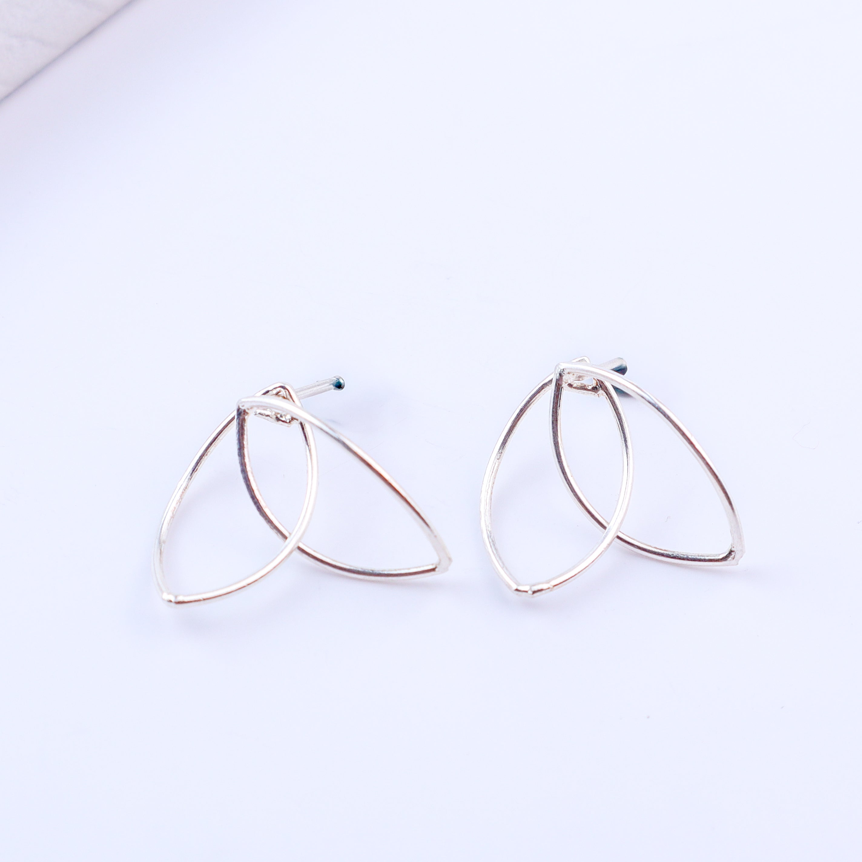 Petal arc hoops styled with modern outfit