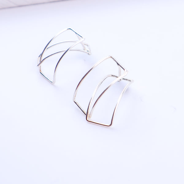 Detail shot highlighting polished silver finish and geometric edges
