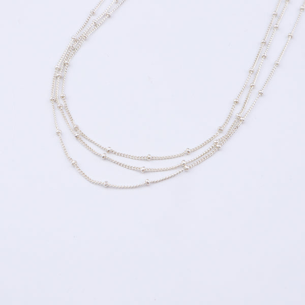 Silver layered necklace close-up