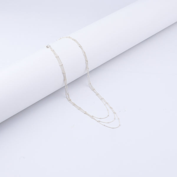 Silver layered necklace detail