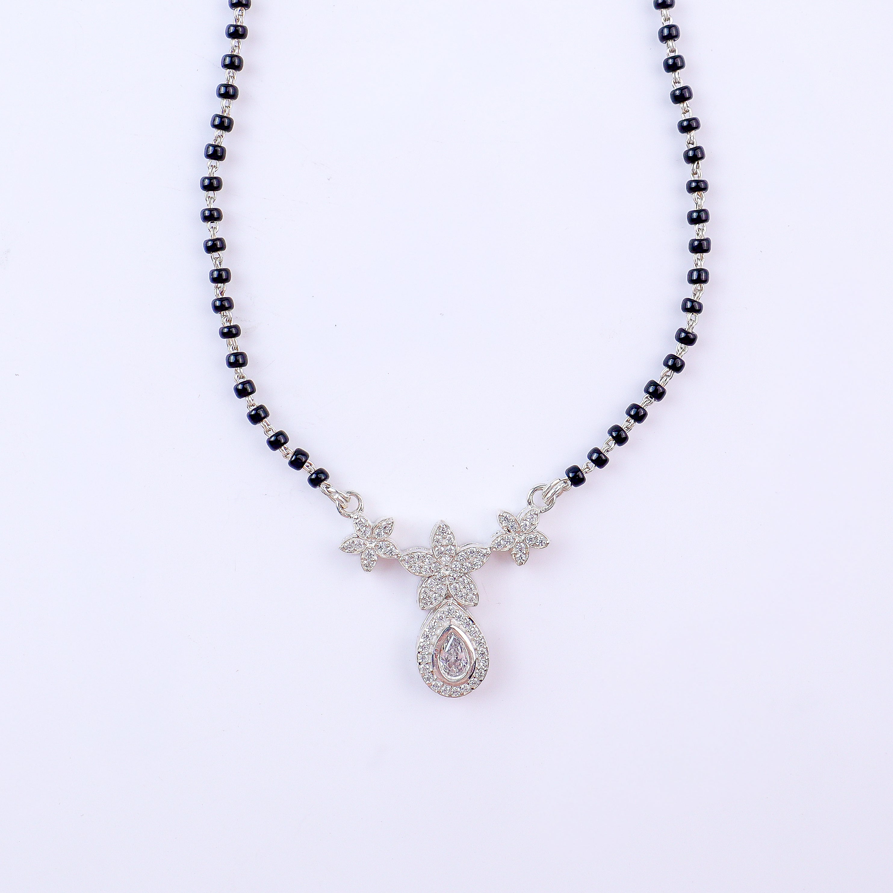 Detail shot highlighting CZ sparkle and floral craftsmanship