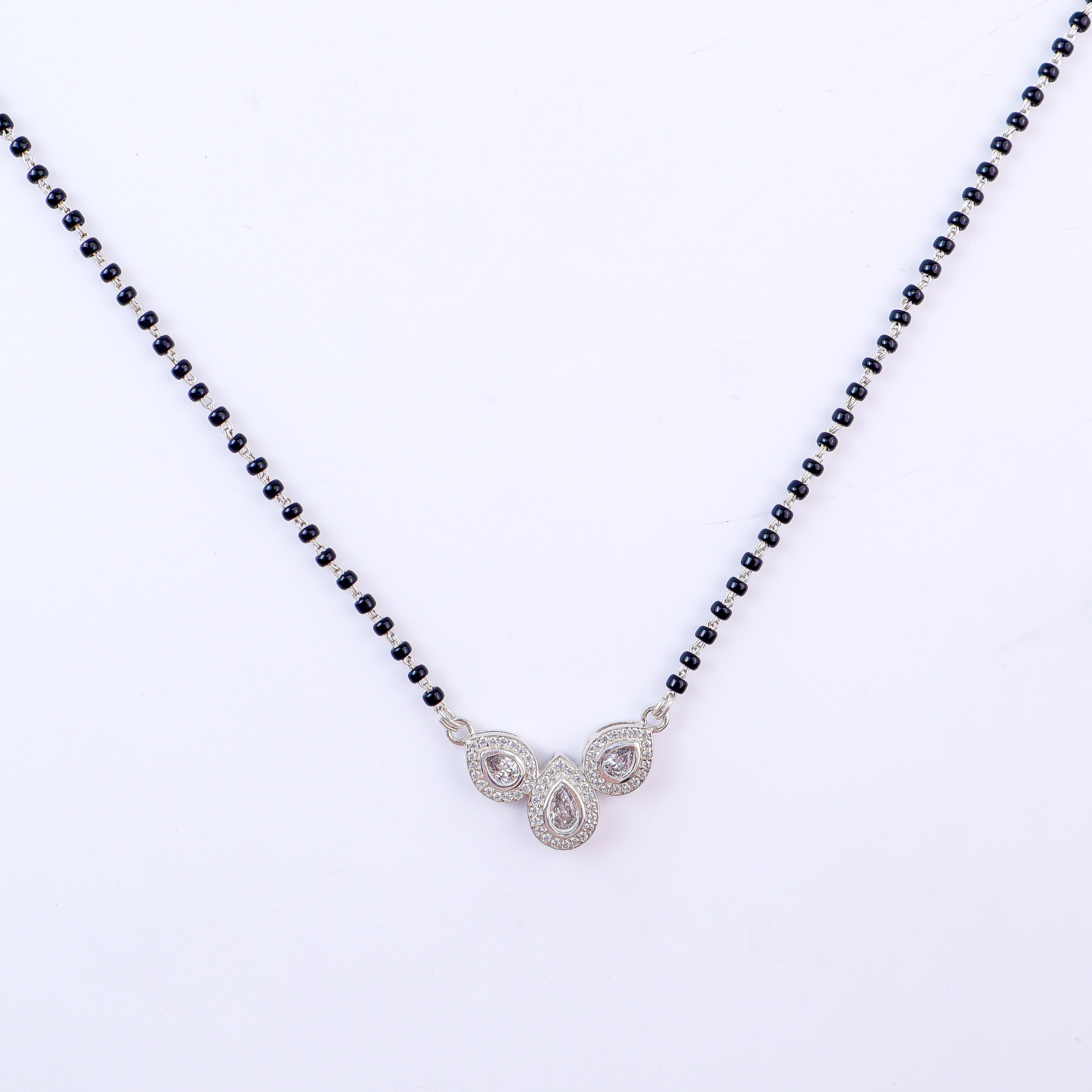 CZ petal mangalsutra styled with saree and modern outfit