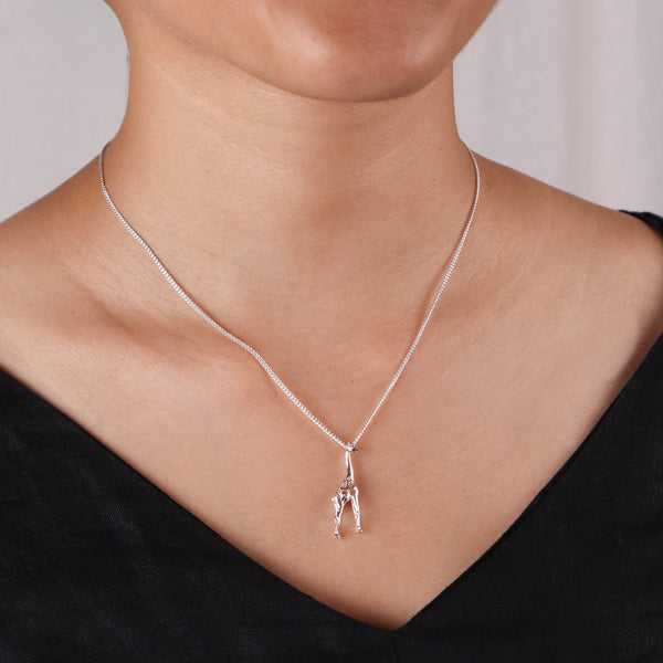 Model wearing silver giraffe pendant necklace