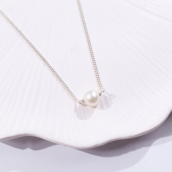 Elegant pearl necklace with silver chain and large pearl pendant