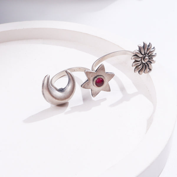 Silver flower and star jewelry with red gemstone