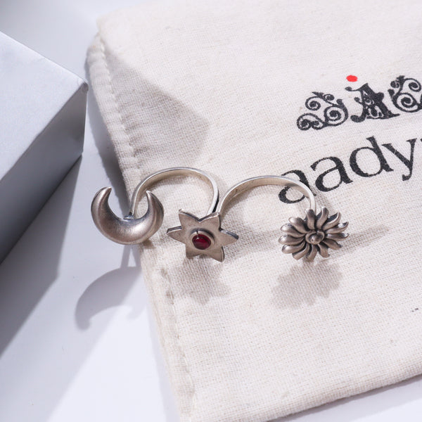 Silver rings on fabric with printed text