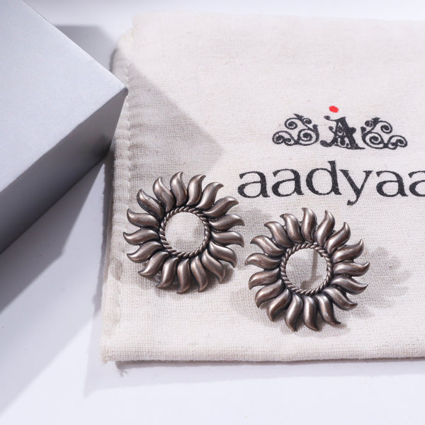 Sterling silver sun-inspired earrings with intricate design