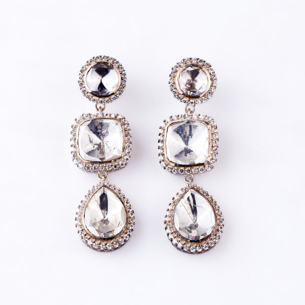 Silver earrings with large clear stones and surrounding smaller stones