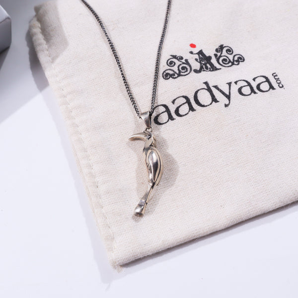 Silver Hornbill pendant on fabric