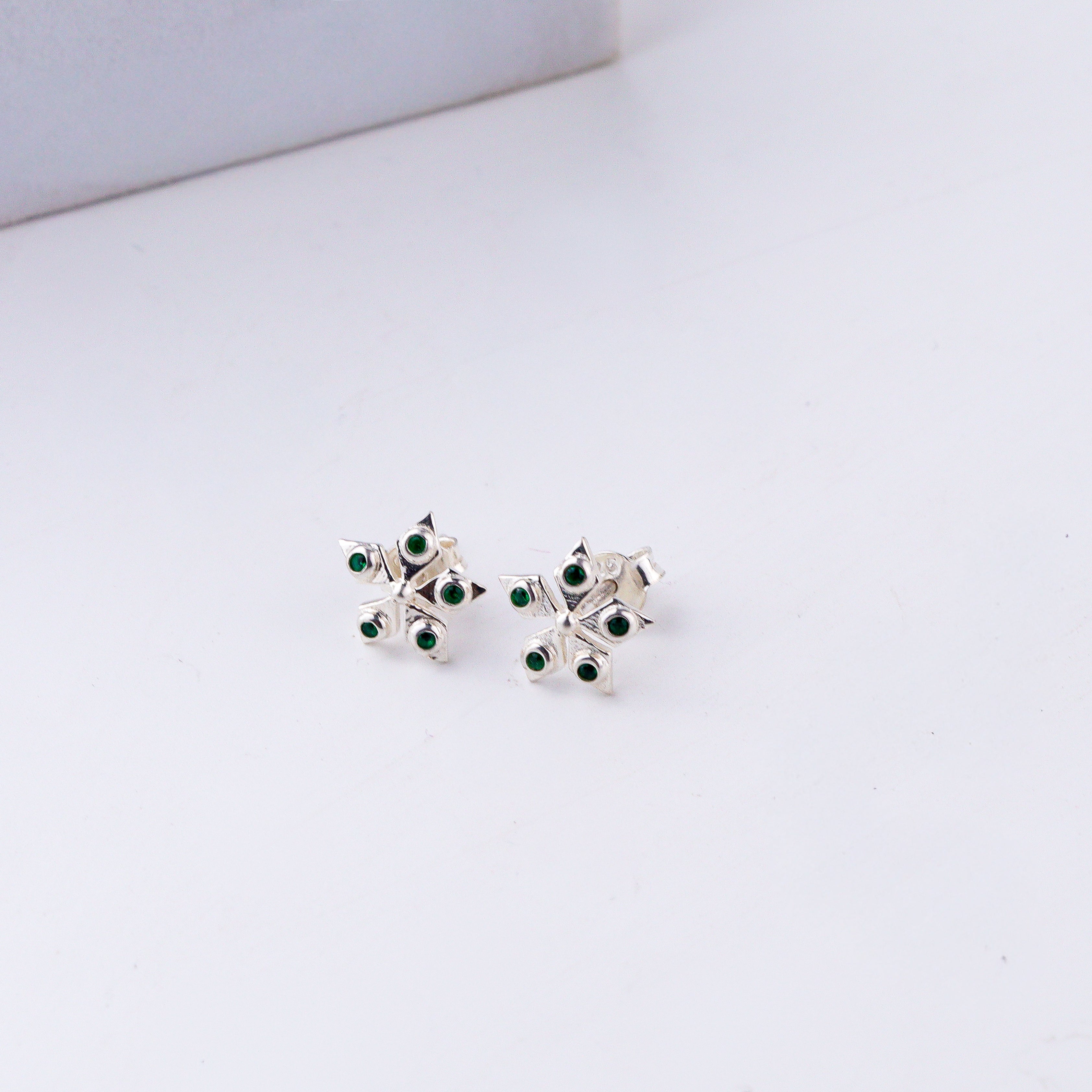 Handcrafted silver Nakshatra studs polished finish