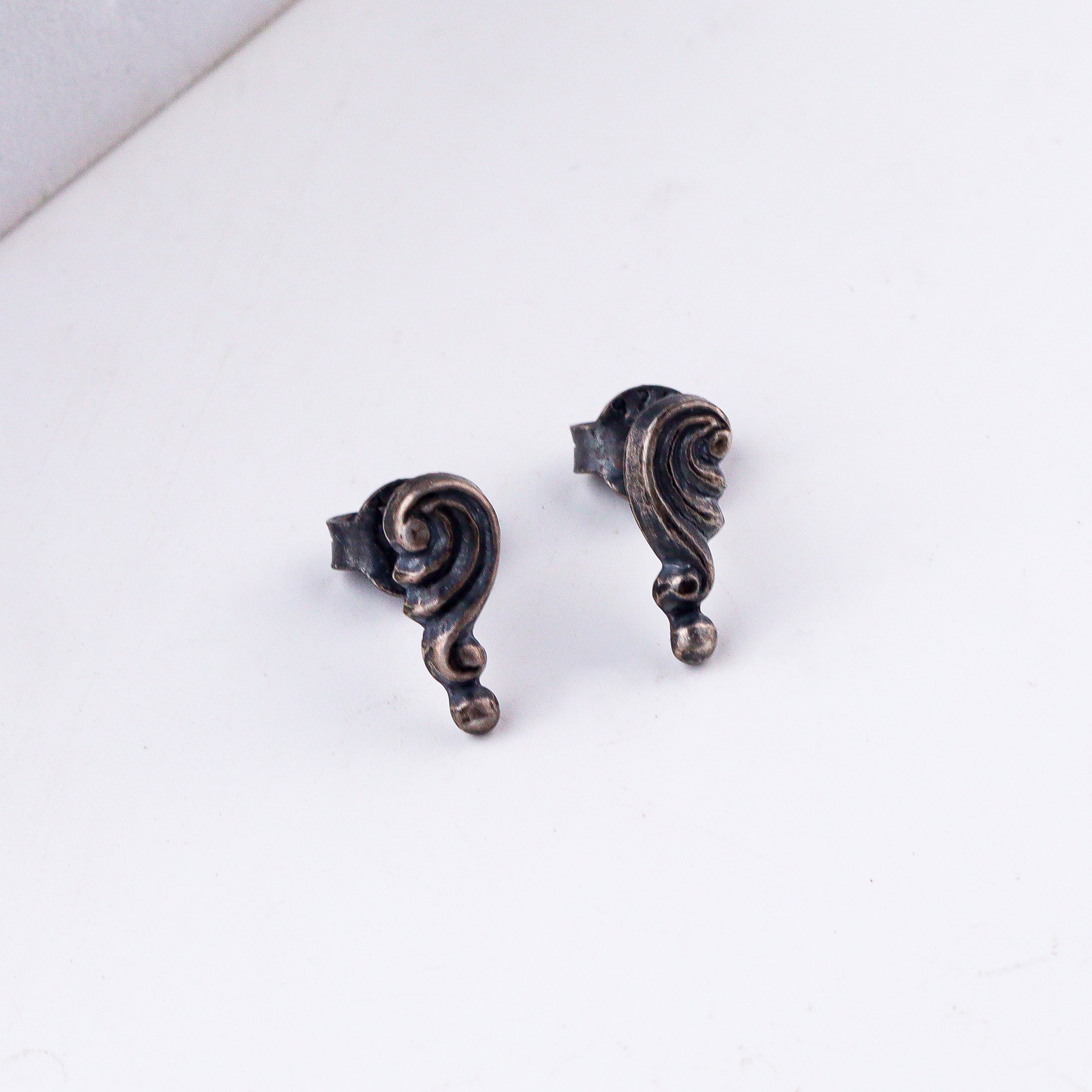 Handcrafted silver shell studs with antique finish