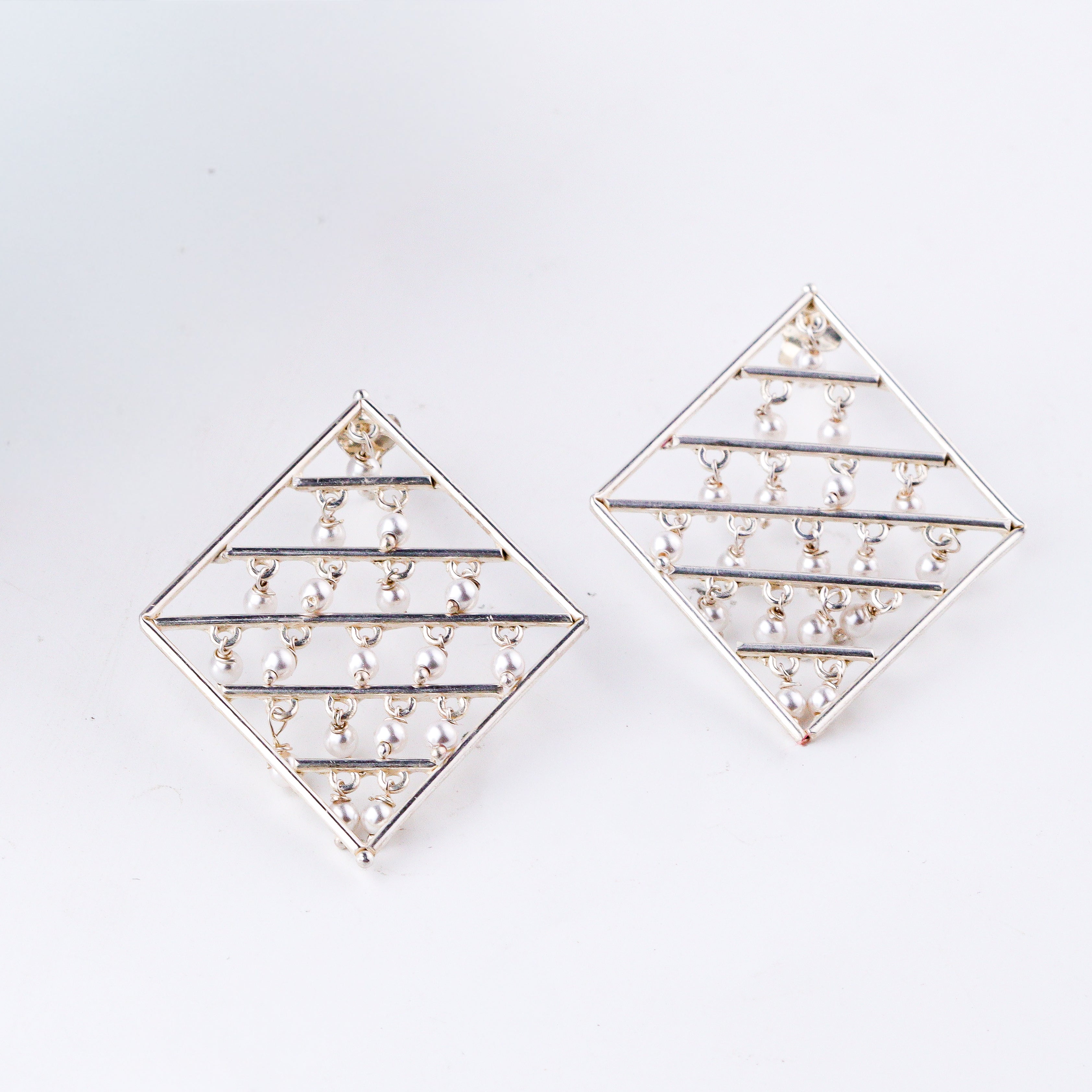 Silver geometric pearl earrings in 92.5 sterling silver