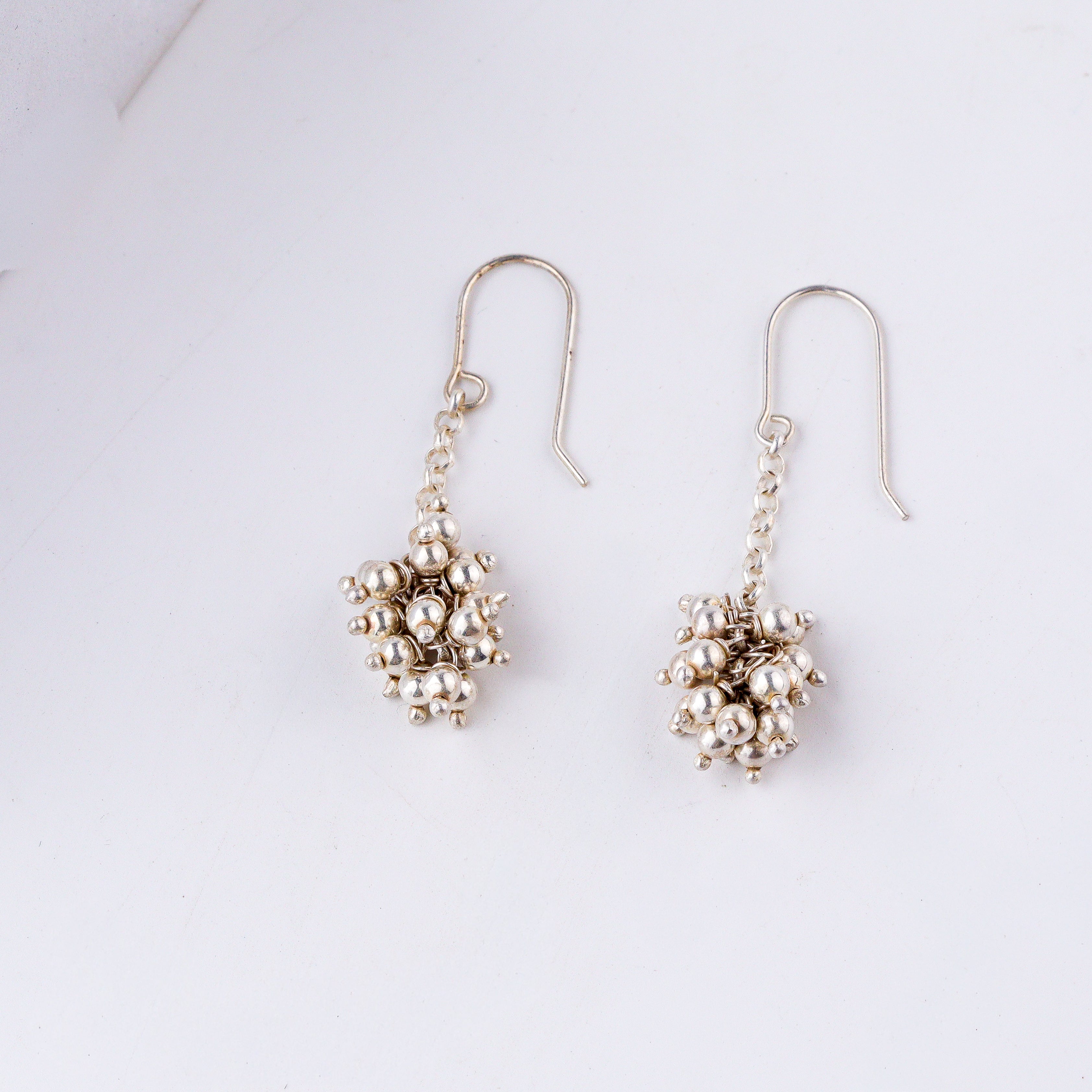 style silver bead bunch earrings with ethnic outfit