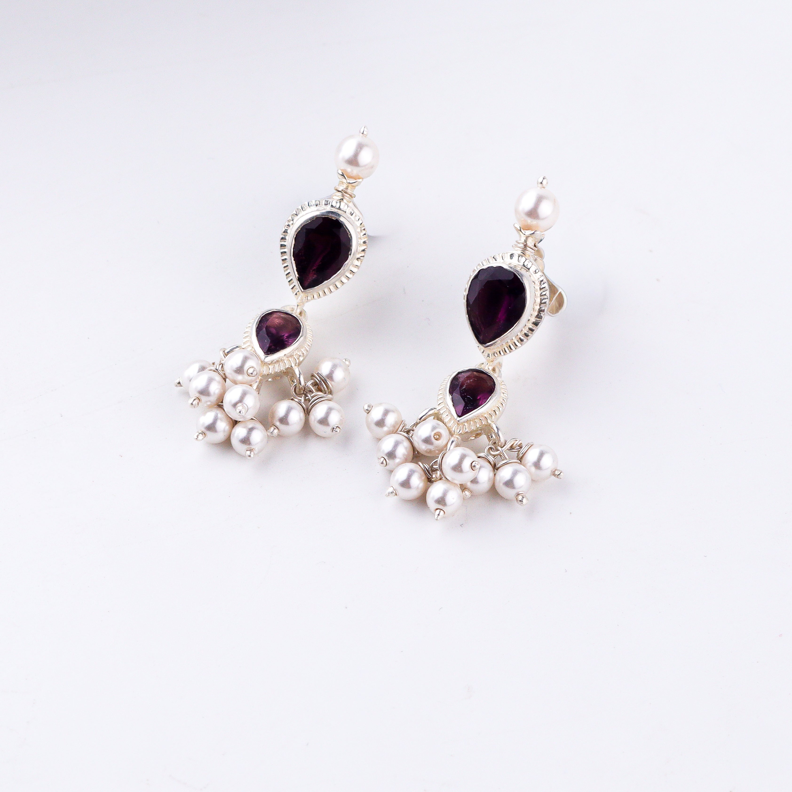 Handcrafted tanmani style silver earrings with amethyst stone