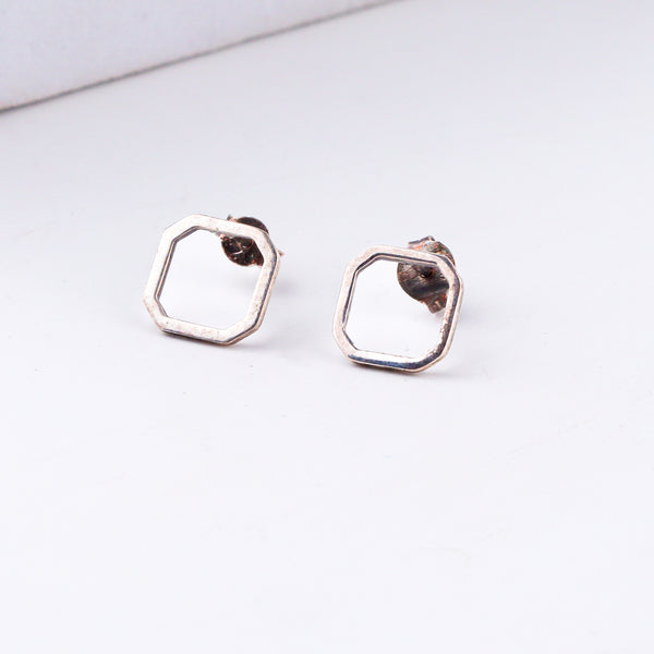 Tiny silver squircle stud earrings in 92.5 sterling silver
