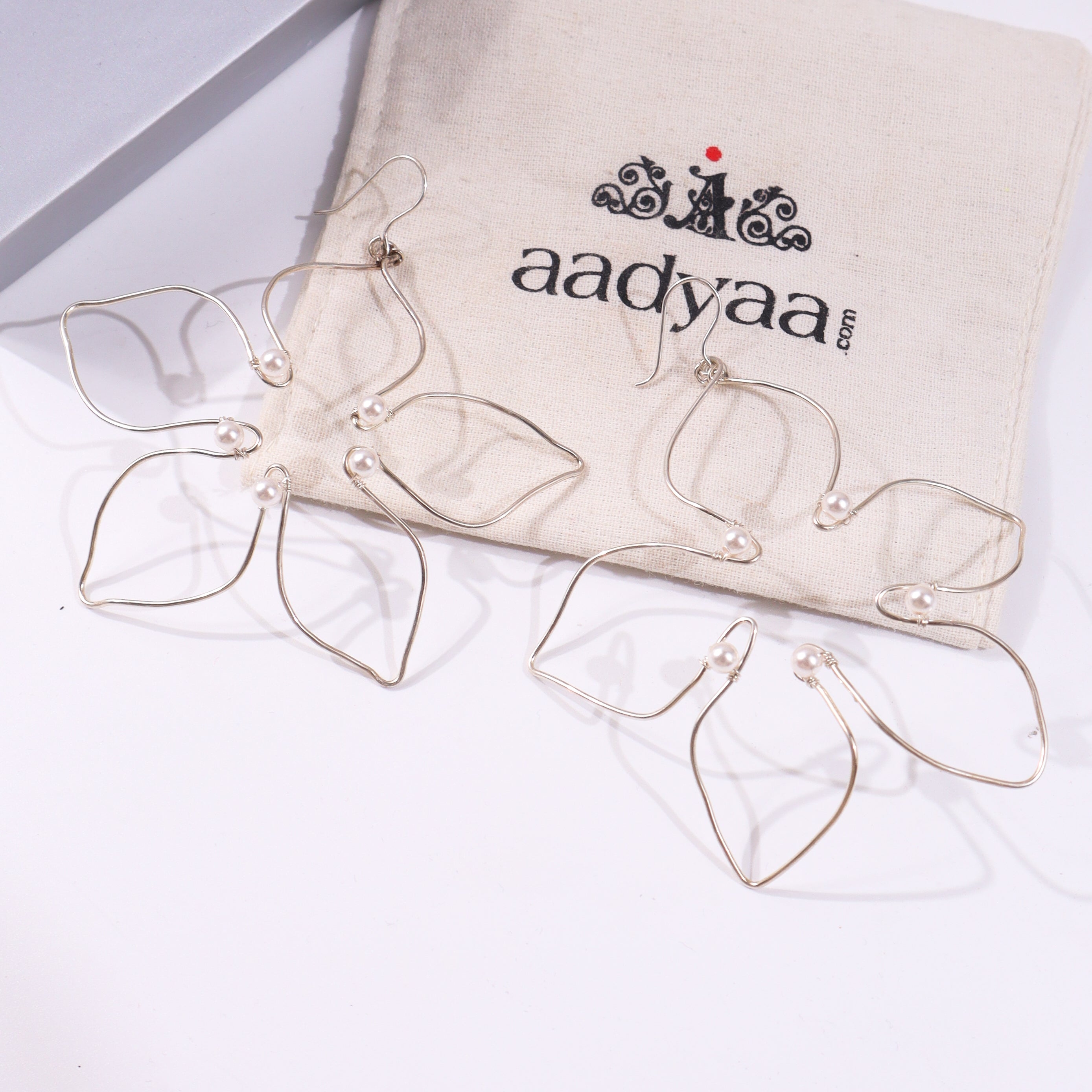 Silver hoop earrings with pearl accents