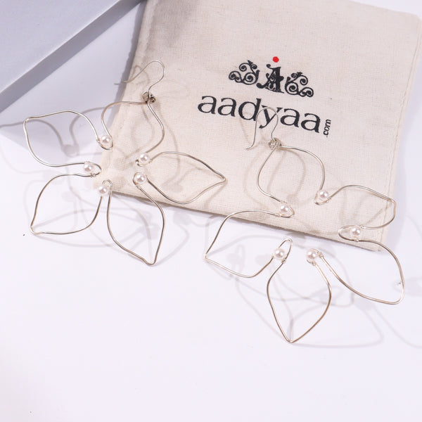 Silver hoop earrings with pearl accents