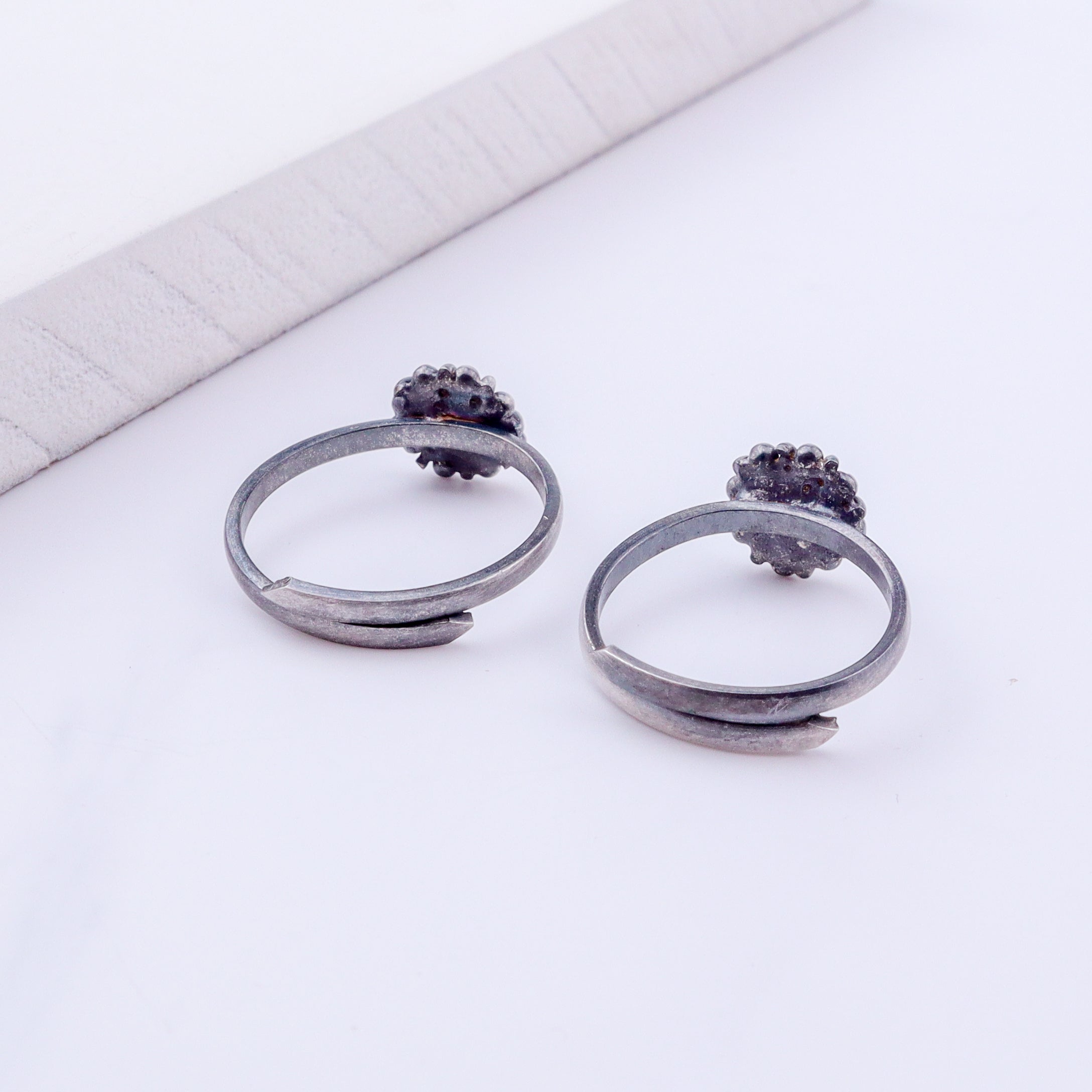 Detail shot highlighting polished silver finish and adjustable band