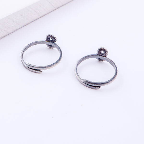 Detail shot highlighting polished silver finish and open band