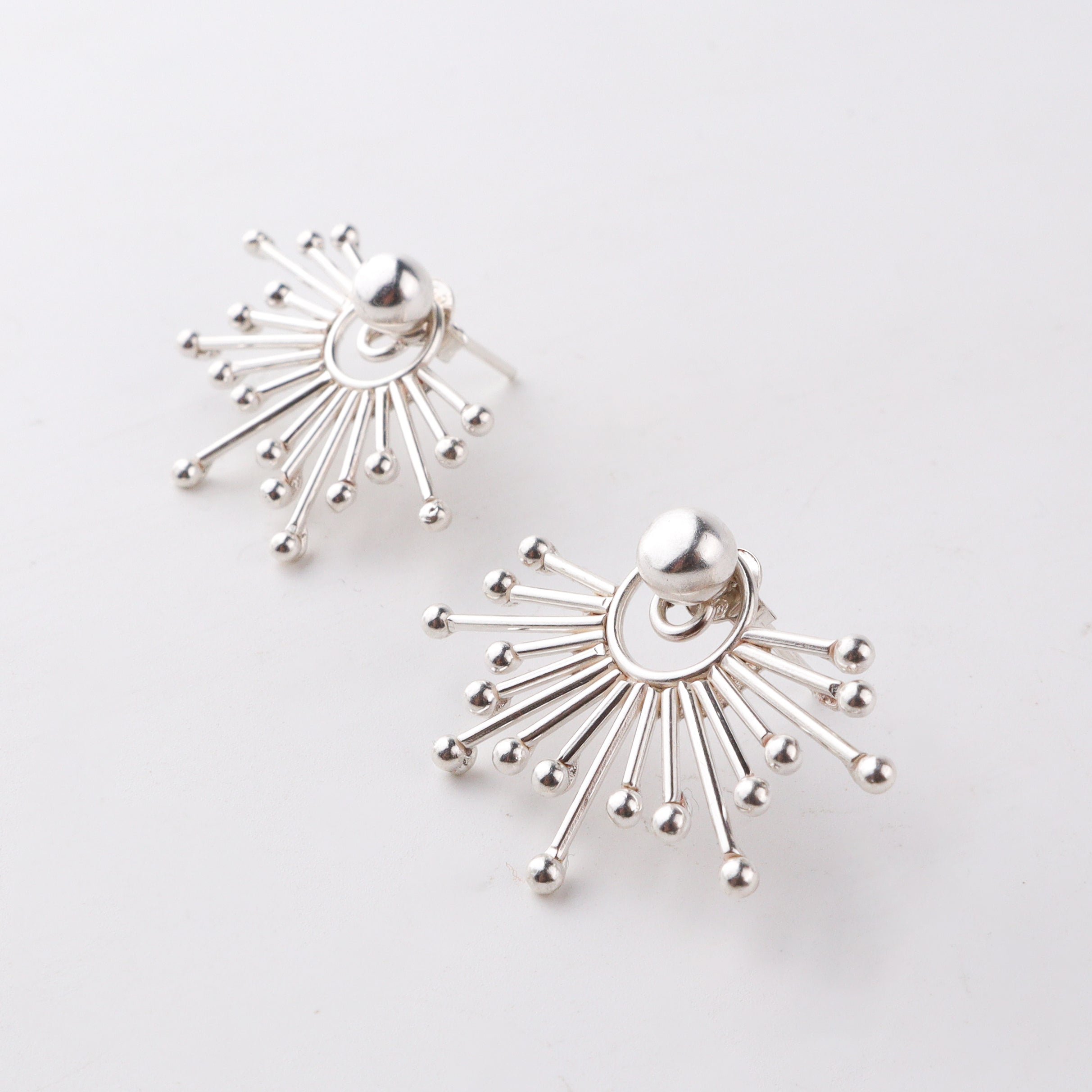Handcrafted silver sparkle jacket earrings close-up detailing