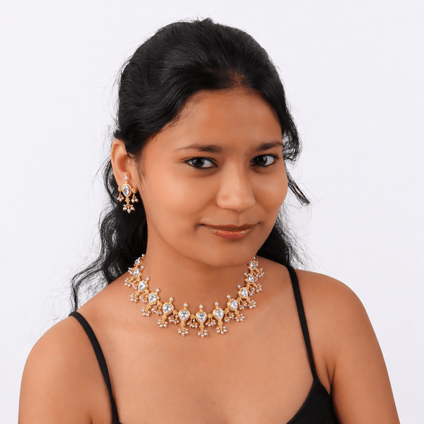 Elegant gold and diamond jewelry set with necklace and earrings